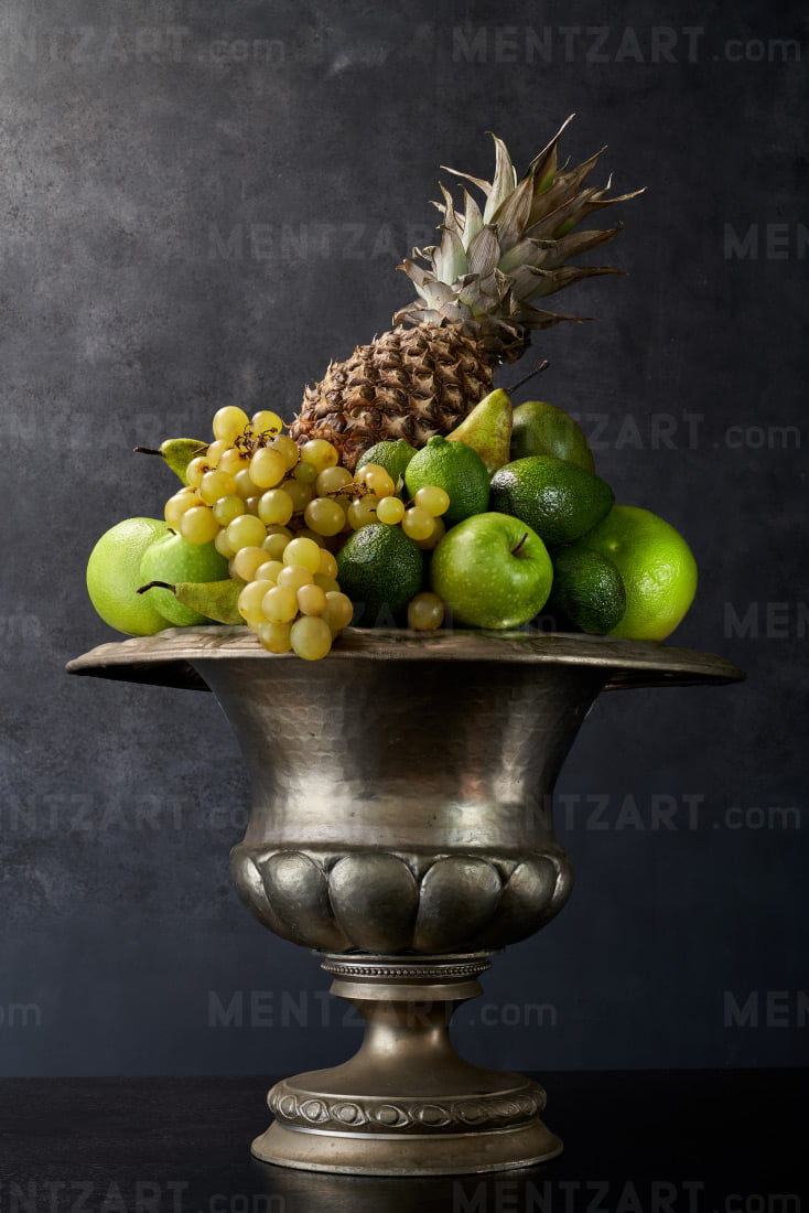 Still life with green fruit and pineapple