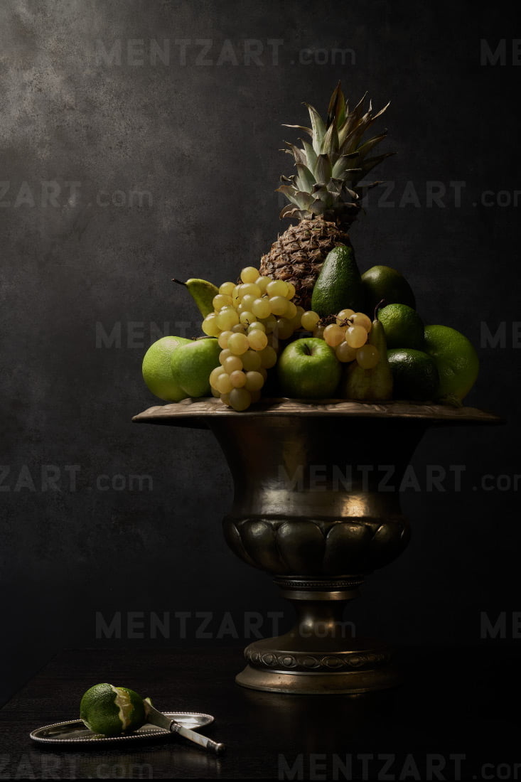 Still life with green fruits and lime